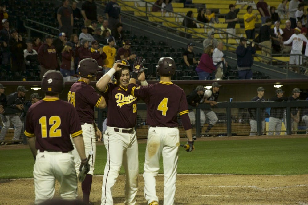 Players of ASU baseball celebrate consecutive home runs during the game against Nevada on Tuesday, Feb. 23, 2016&nbsp;at Phoenix Municipal Stadium in Phoenix, Ariz. ASU lost 11-5.