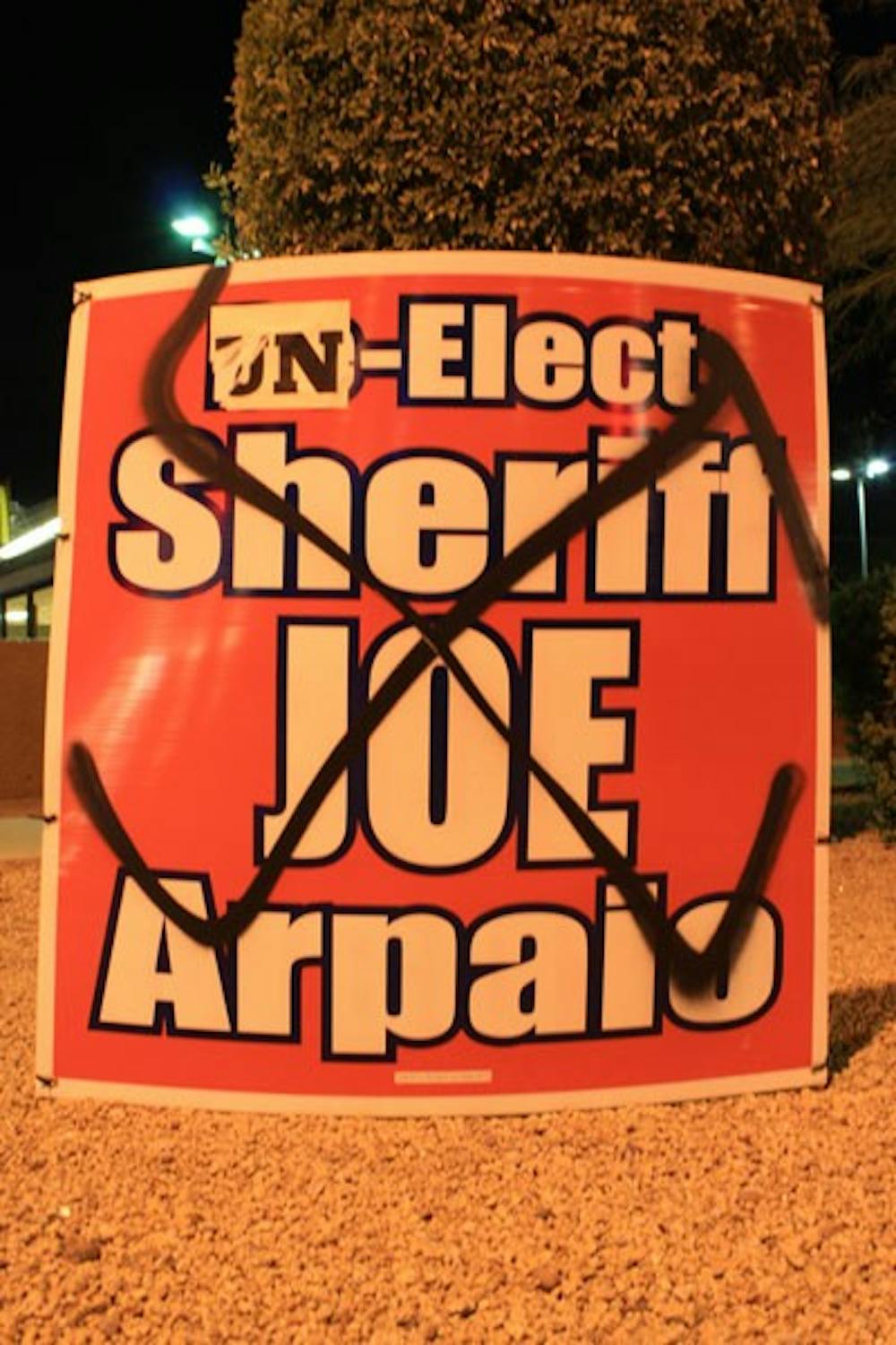 A re-election sign for Maricopa County Sheriff Joe Arpaio was vandalized on 7th Street and McDowell Road in Phoenix. Both Arpaio and his main opponent, former Phoenix police officer Paul Penzone, have had signage vandalized or stolen. (Photo by Jessie Wardarski)