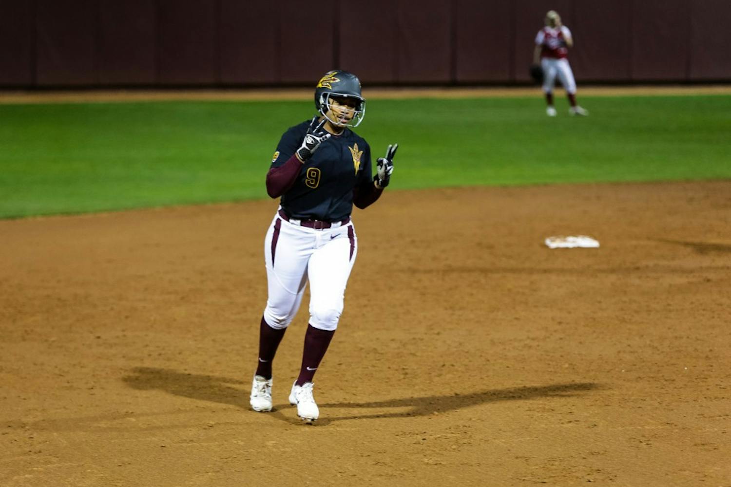 ASU senior catcher Amber Freeman throws up the pitchforks after hitting a solo home run during the ASU vs. Indiana softball game at Farrington Stadium on Feb. 7, 2015. Freeman’s pinch hitting would 
prove clutch for the Sun Devils, helping their offense to 10-2 explosion over the visiting Hoosiers.
