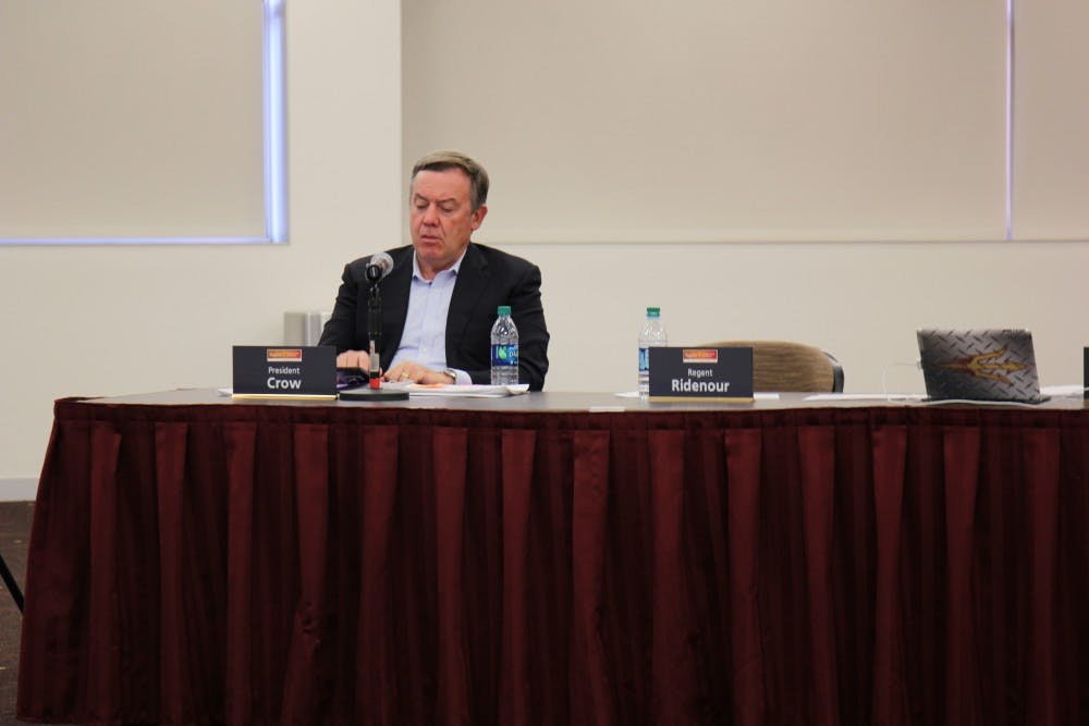 Micheal Crow sits with ABOR board members during the tuition hearing on March 30, 2017 on ASU's Tempe campus.