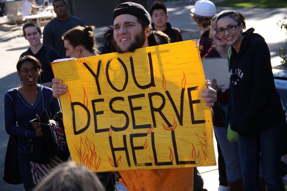 ASU students most often react with humor and rebuttals at the controversial preaching on campus. Yet, both parties aren't swayed to stop preaching or rebutting. 
Photo by Shawn Raymundo