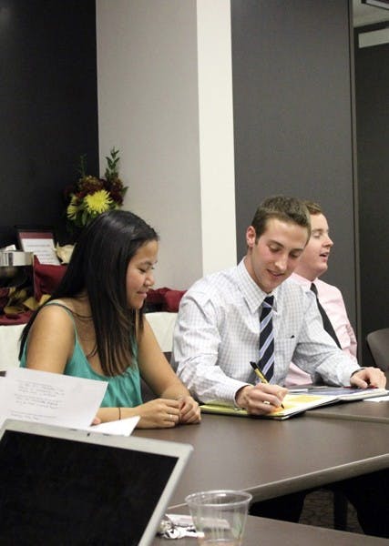 STUDENT LEADERS: Tina Mounlavongsy, USG President Jacob Goulding, and James Baumer address the senate at a USG meeting Tuesday evening to discuss several topics, including adding more emergency light boxes on campus as a preventative measure. (Photo by Sam Rosenbaum)
