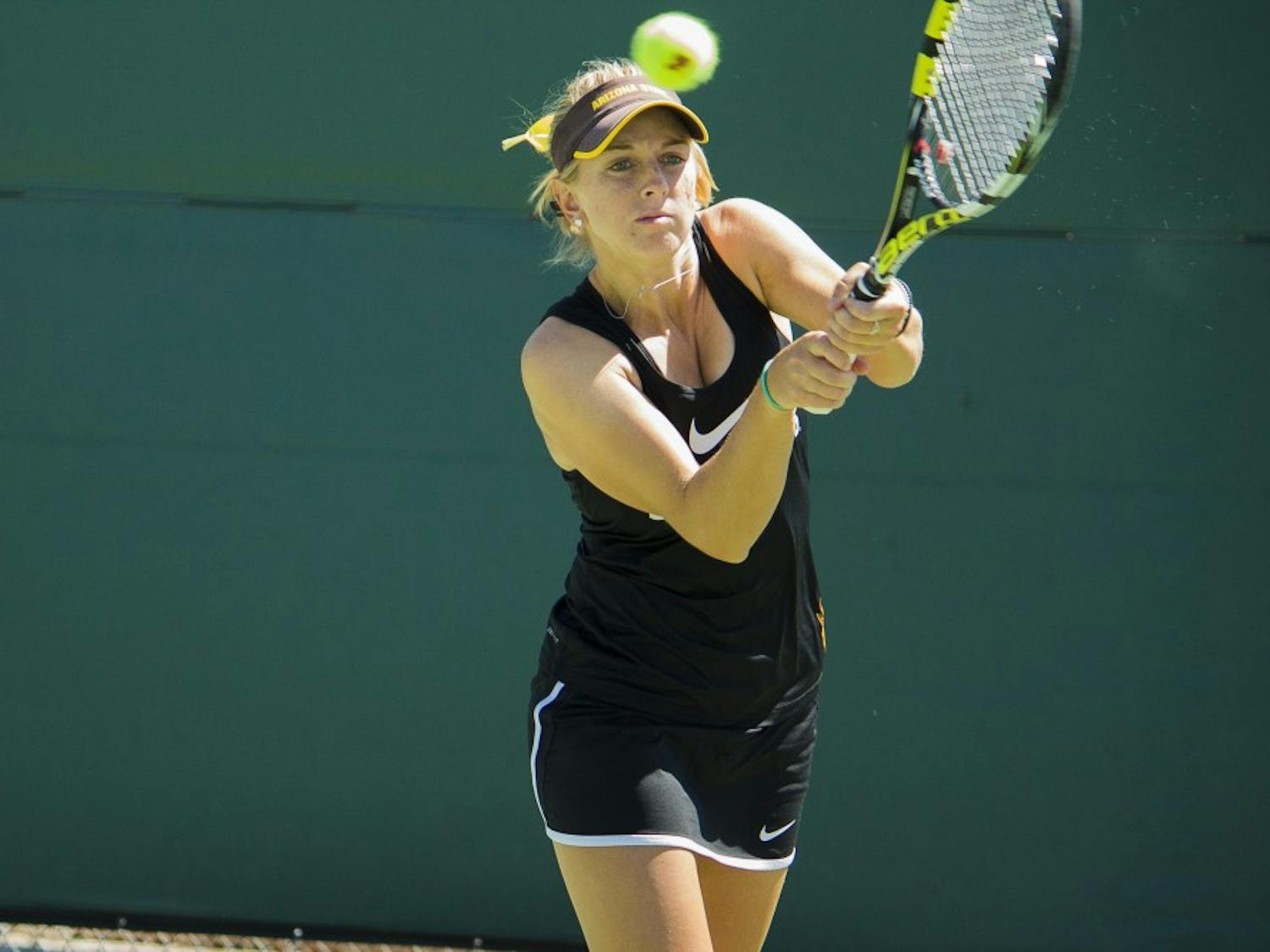 ASU Senior Joanna Smith returns with a backhand during her 4-6 6
