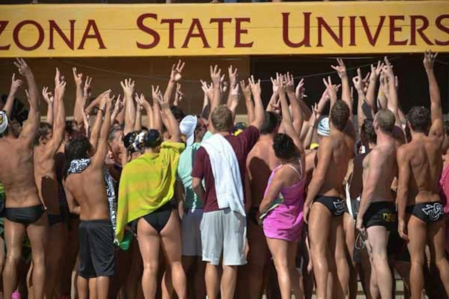 Hands Up: The ASU swim team joins together after a meet earlier this season. The swim team has experienced a rougher start to the season than the dive team due to a large number of freshman on the roster. (Photo by Aaron Lavinsky)