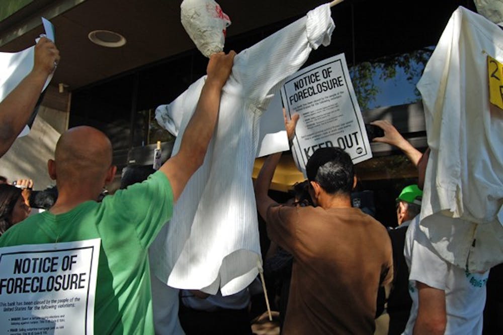 Occupy protesters stood outside Bank of America on Thursday afternoon in downtown Phoenix and voiced their concerns about foreclosures and bank injustice. (Photo by Thania A. Betancourt)