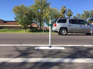 A buffer that separates driving lanes and the bike lanes on McClintock Drive between Guadalupe and Broadway roads on Nov. 21, 2016.