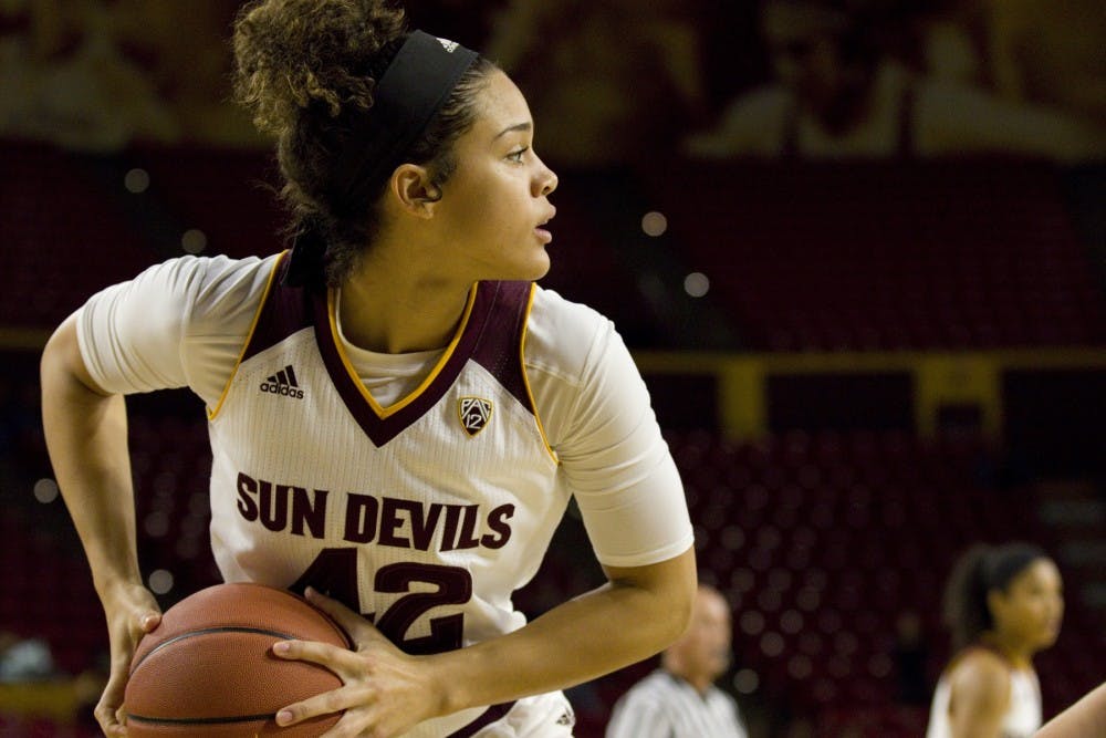 ASU sophomore forward Kianna Ibis (42) looks towards the basket to try and make a pass during a women's basketball game versus no. 8 Washington in Wells Fargo Arena in Tempe, Arizona on Sunday, Jan. 15, 2017. ASU lost 65-54, putting them at 13-4 on the season.