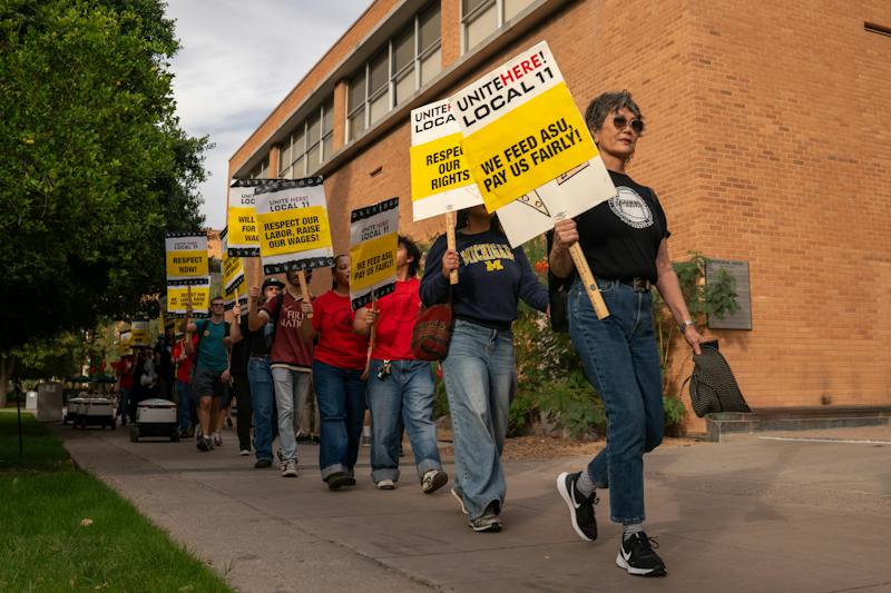 Protesters form a picket line outside the Memorial Union on Thursday, Nov. 13, 2025, in Tempe.