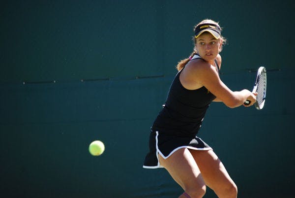Senior Jacqueline Cako sets both of her feet to prepare for a two-hand swing against Pepperdine on Feb. 23. Led by Cako in the No. 1 position the ASU tennis team swept Utah State on March 1 and Saint Mary's on March 2. (Photo by Murphy Bannerman)