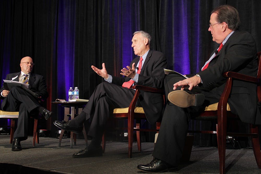 (left to right) Richard Morrison, Morrison Institute for Public Policy Board of Advisors chairman, former U.S. Senator Jon Kyl, and Grady Gammage Jr., Morrison Institute senior research fellow, speak about the future of Arizona’s water supply at a forum in the Phoenix Airport Marriott Hotel on Tuesday afternoon. (Photo by Shawn Raymundo)