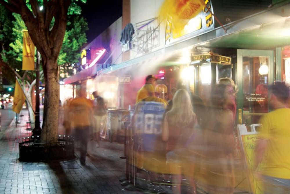 In an effort to reduce noise, the City of Tempe is now requiring street performers on Mill Avenue, not just businesses, to obtain special events permits when using amplifiers. (Photo by Jenn Allen)