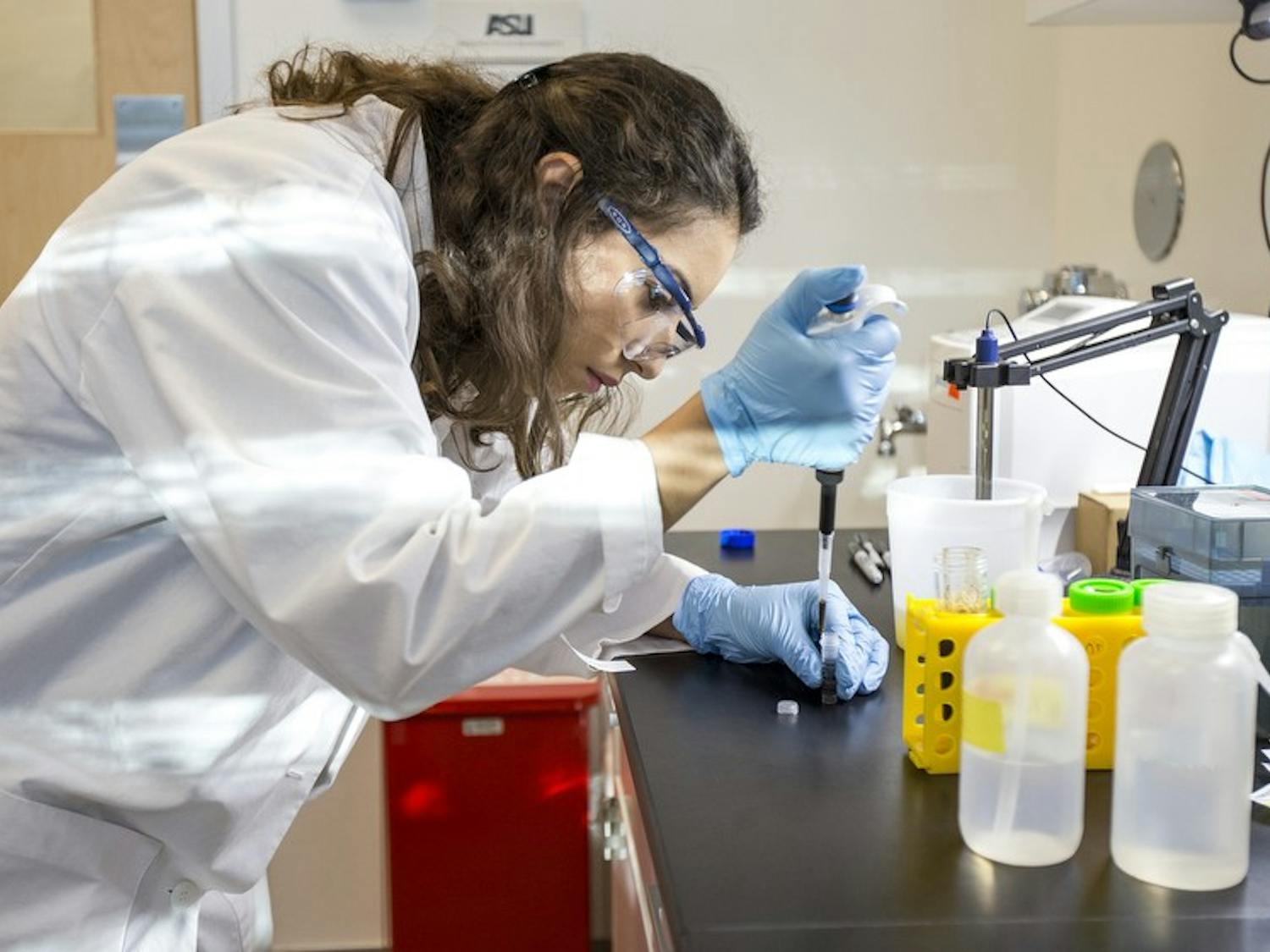 Nutrition and Dietetics major Almarie Riveria measures the PH balance of a DevilWASTE sample at the Phoenix Biomedical Campus on Thursday, Oct. 8, 2015. ASU researchers started the DevilWASTE program to analyze the nutritional habits of students over the course of their freshman year.