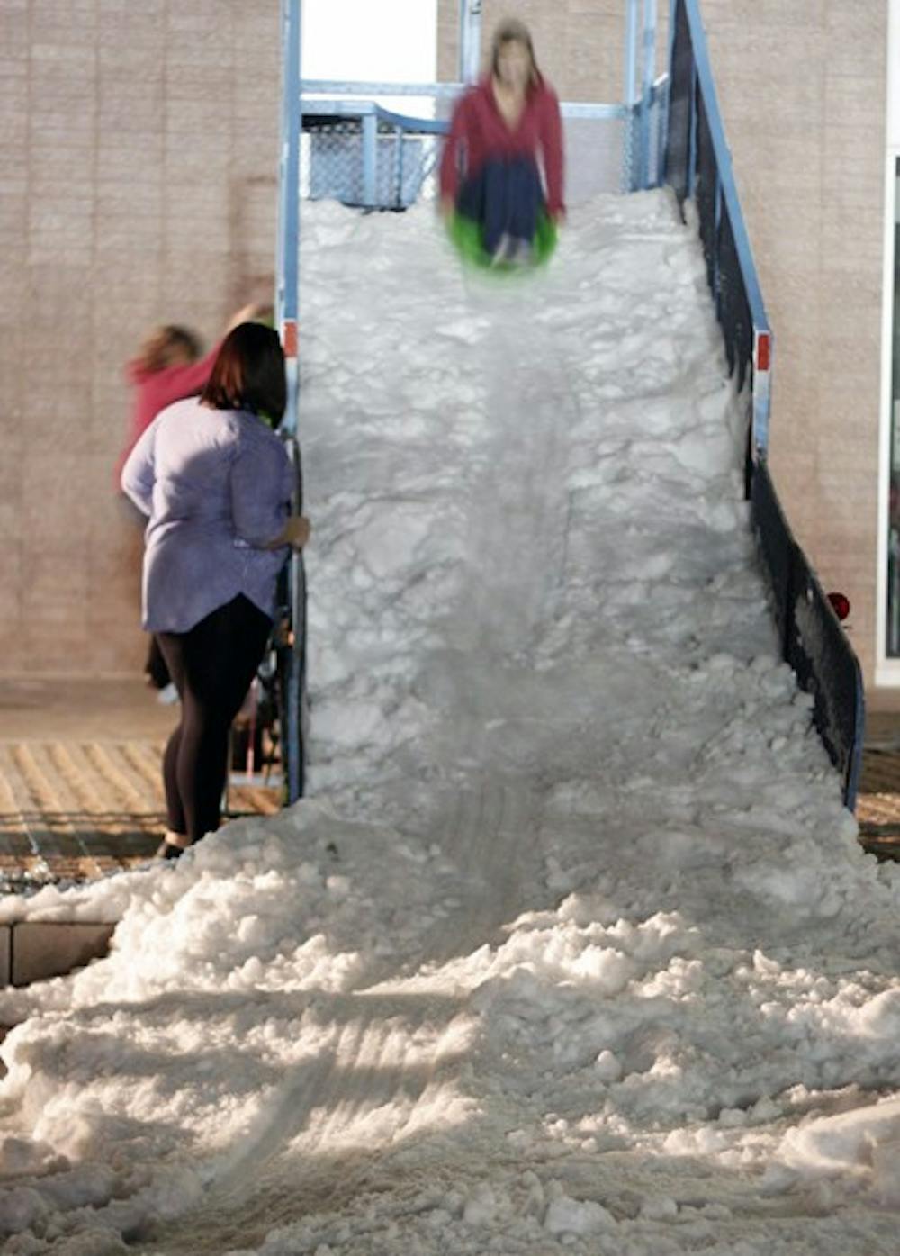 Students gathered in the Hassyampa courtyard for the first ever winter ASYule Ball. The attractions featured included Butterbeer, ornament decorating and a snow slide. (Photo by Beth Easterbrook)