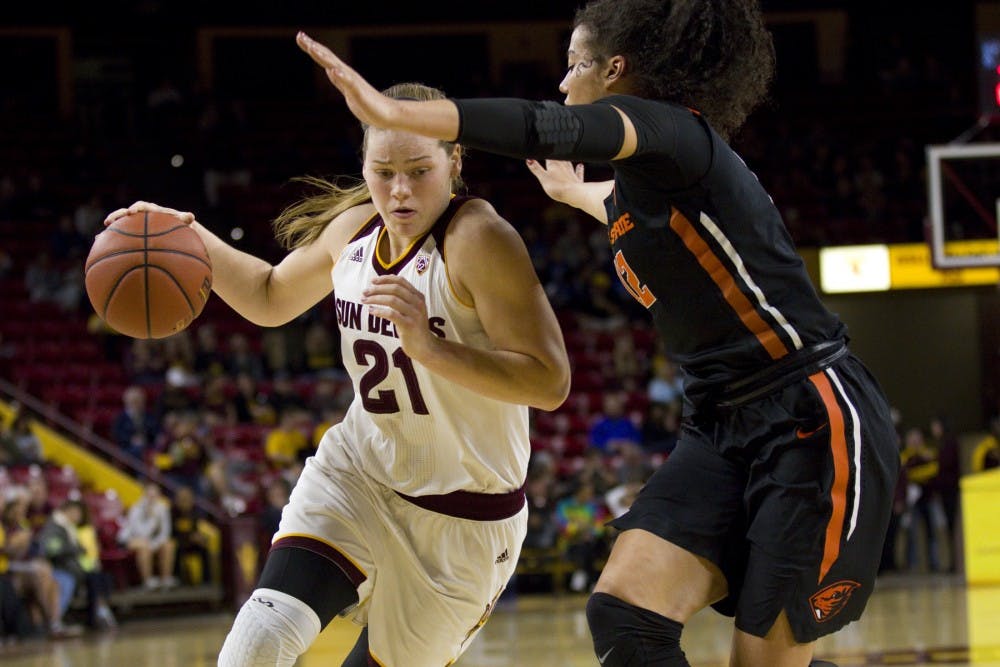 ASU senior forward Sophie Brunner (21) drives towards the basket with Beavers forward Kolbie Orum defending the basket during the women's basketball game versus the Oregon State Beavers in Wells Fargo Arena in Tempe, Arizona on Friday, Feb. 3, 2017. ASU lost 54-45. (Josh Orcutt/State Press)