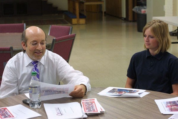 OPEN TABLE OUT REACH: Open Table founder Jon Katov and ASU '09 alumnus Jessica Stocks, explains the importance of a program like Open Table during the meeting at the First Methodist Church on University Drive Wednesday. Open Table is a ministry that serves an out reach program for impoverished families. (Photo by Serwaa Adu-Tutu)