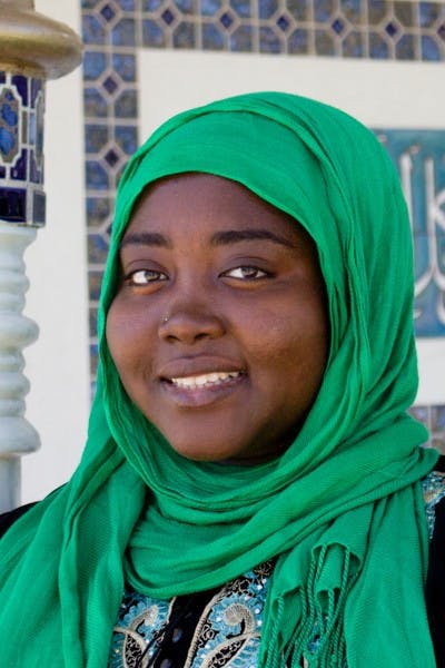 Najla Abdalla stands in front of the Islamic Community Center in Tempe while wearing her abaya, a robe-like dress, worn by some women in parts of the Muslim world, including North Africa and the Arabian Peninsula. (Photo by Andrew Nicla)