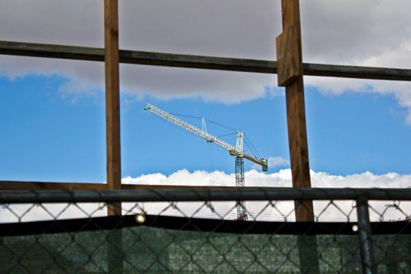 The construction work of a new church is framed on University Drive and College Avenue on a cloudy afternoon. (Photo by Marissa Krings)