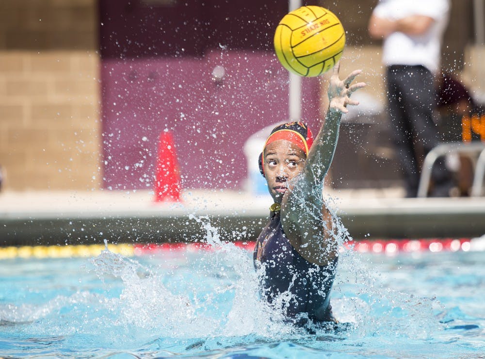 ASU goalie Mia Rycraw reaches out to block a shot on goal during a game against the Cal State Bears at Mona Plummer Aquatic Center in Tempe, Arizona, on Saturday, April 2, 2016. The Sun Devils won the match, 7-6, in sudden-death overtime. 