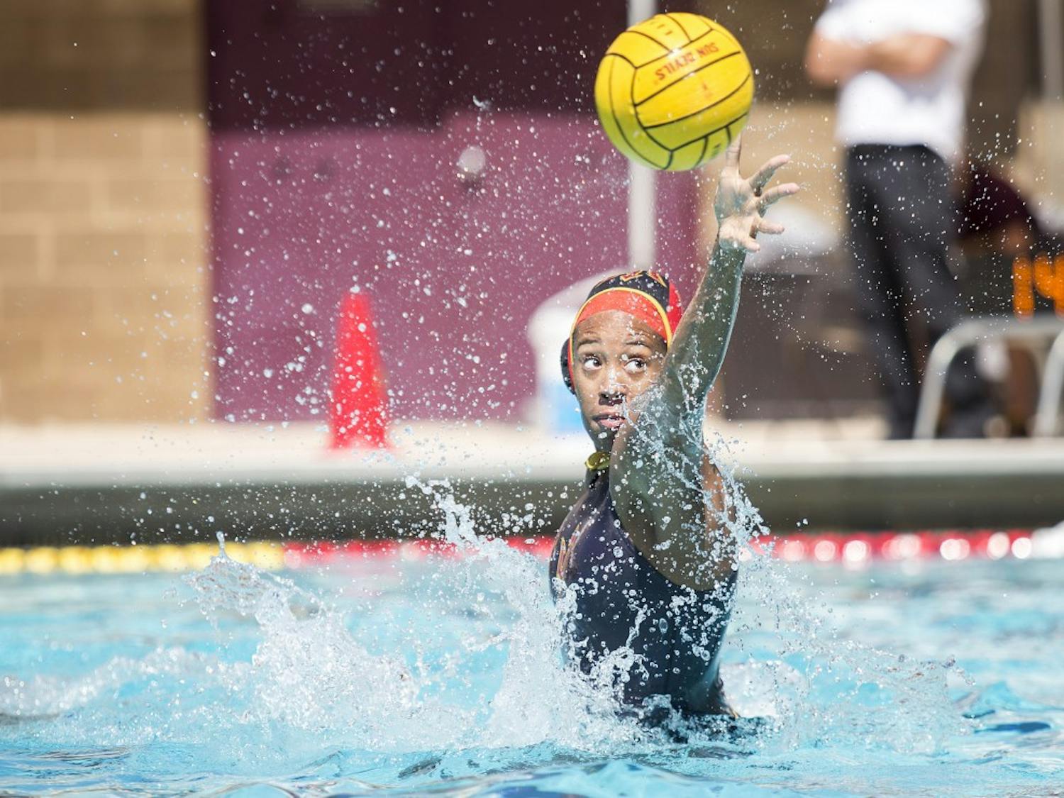 ASU goalie Mia Rycraw reaches out to block a shot on goal during a game against the Cal State Bears at Mona Plummer Aquatic Center in Tempe, Arizona, on Saturday, April 2, 2016. The Sun Devils won the match, 7-6, in sudden-death overtime. 