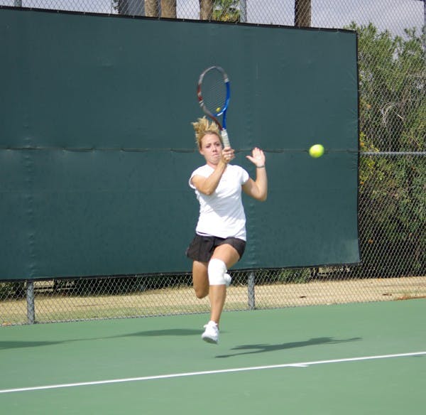 SEND OFF: Junior Hannah James returns a volley during a match last season. James advanced as far to the semifinals of the Cal Nike Invitational over the weekend. (Photo by Nathan Meacham)