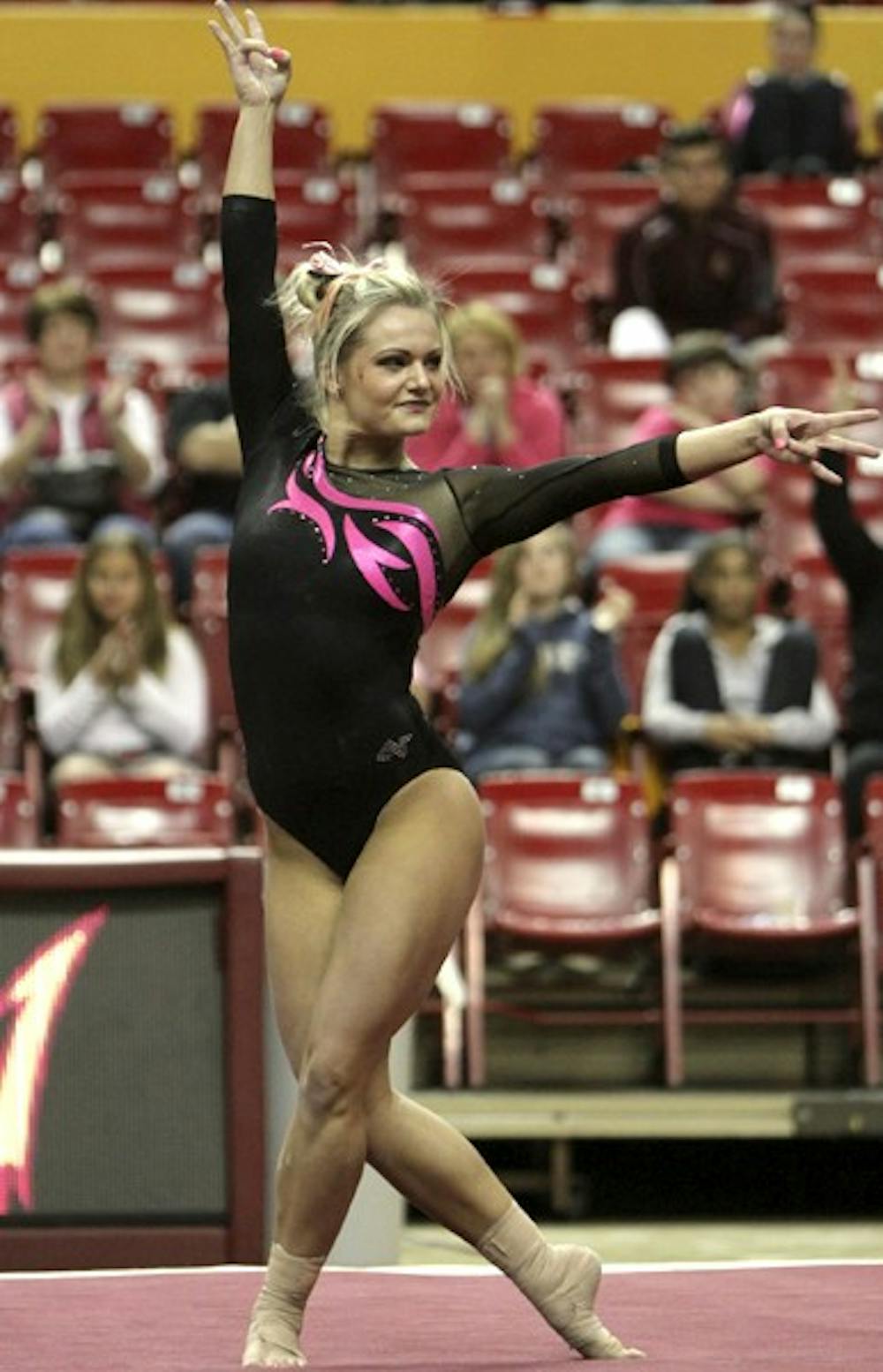 Sophomore Natasha Sundby scored the Sun Devil's first 9.900 of the season for her floor routine at the Jan. 25 meet against UCLA. The gymnasts wore pink leotards to promote breast cancer awareness. (Photo by Sam Rosenbaum)