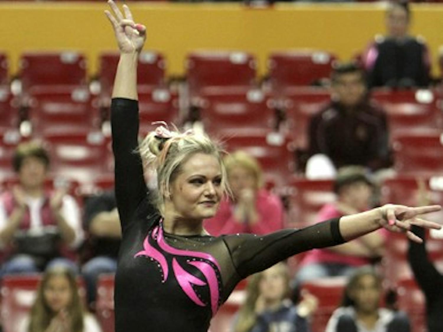 Sophomore Natasha Sundby scored the Sun Devil's first 9.900 of the season for her floor routine at the Jan. 25 meet against UCLA. The gymnasts wore pink leotards to promote breast cancer awareness. (Photo by Sam Rosenbaum)