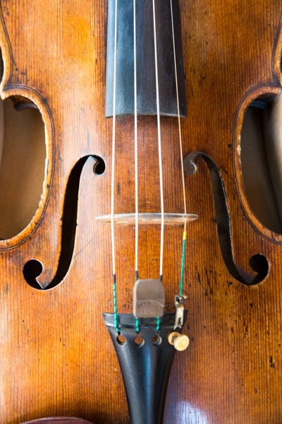 The violin that violin performance sophomore Xiangyuan Huang will perform with at Carnegie Hall sits in its case. The violin was made by Josephus Baldantonus and is rented by ASU to students on a semester-long basis. (Photo by Andrew Ybanez)
