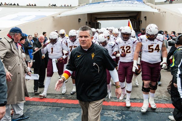 Head coach Todd Graham leads the Sun Devils onto the field before the Sun Bowl against Duke, Saturday, Dec. 27, 2014 at Sun Bowl Stadium in El Paso. (Ben Moffat/The State Press)