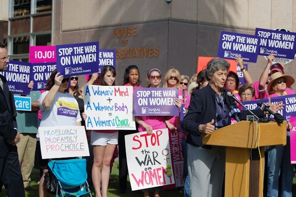 Locals and legislators like Sen. Paula Aboud, D-Tucson, came together against “anti-women” bills during the "War on Woman" rally on the Senate Lawn Wednesday. (Photo by Thania A. Betancourt)