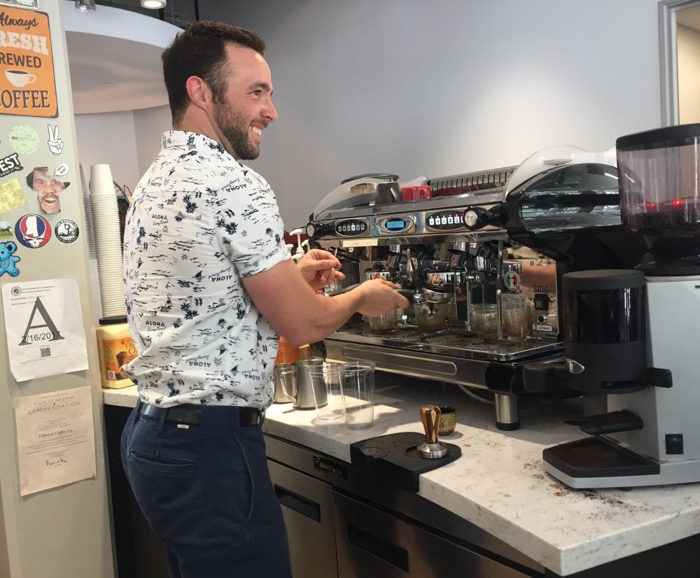 Fillmore Coffee Co. owner Mike Atwell makes a latte for a customer&nbsp;on Monday,&nbsp;March 27, 2017.