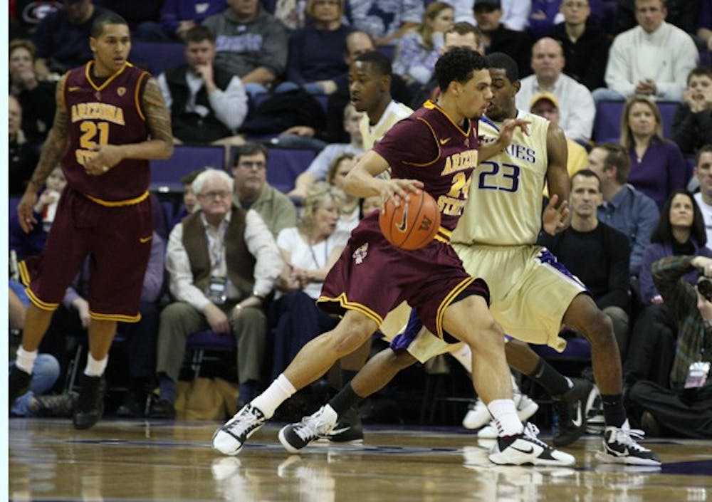 Failed Upset: ASU sophomore guard Trent Lockett attempts to drive past Washington redshirt freshman guard C.J. Wilcox during the Huskies’ 88-75 victory over the Sun Devils on Saturday. (Photo Courtesy of Luke Springer | The Daily of the University of Washington)