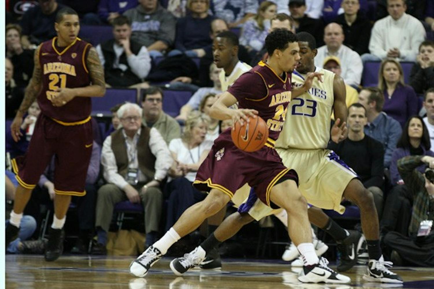 Failed Upset: ASU sophomore guard Trent Lockett attempts to drive past Washington redshirt freshman guard C.J. Wilcox during the Huskies’ 88-75 victory over the Sun Devils on Saturday. (Photo Courtesy of Luke Springer | The Daily of the University of Washington)