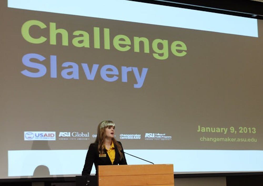 Student Direction of Changemaker Central Kaitlyn Fiztgerald addresses the audience of Challenge Slavery. Challenge Slavery was held in the Memorial Union on Wednesday to inform about the modern slave trade. (Photo by Laura Davis)