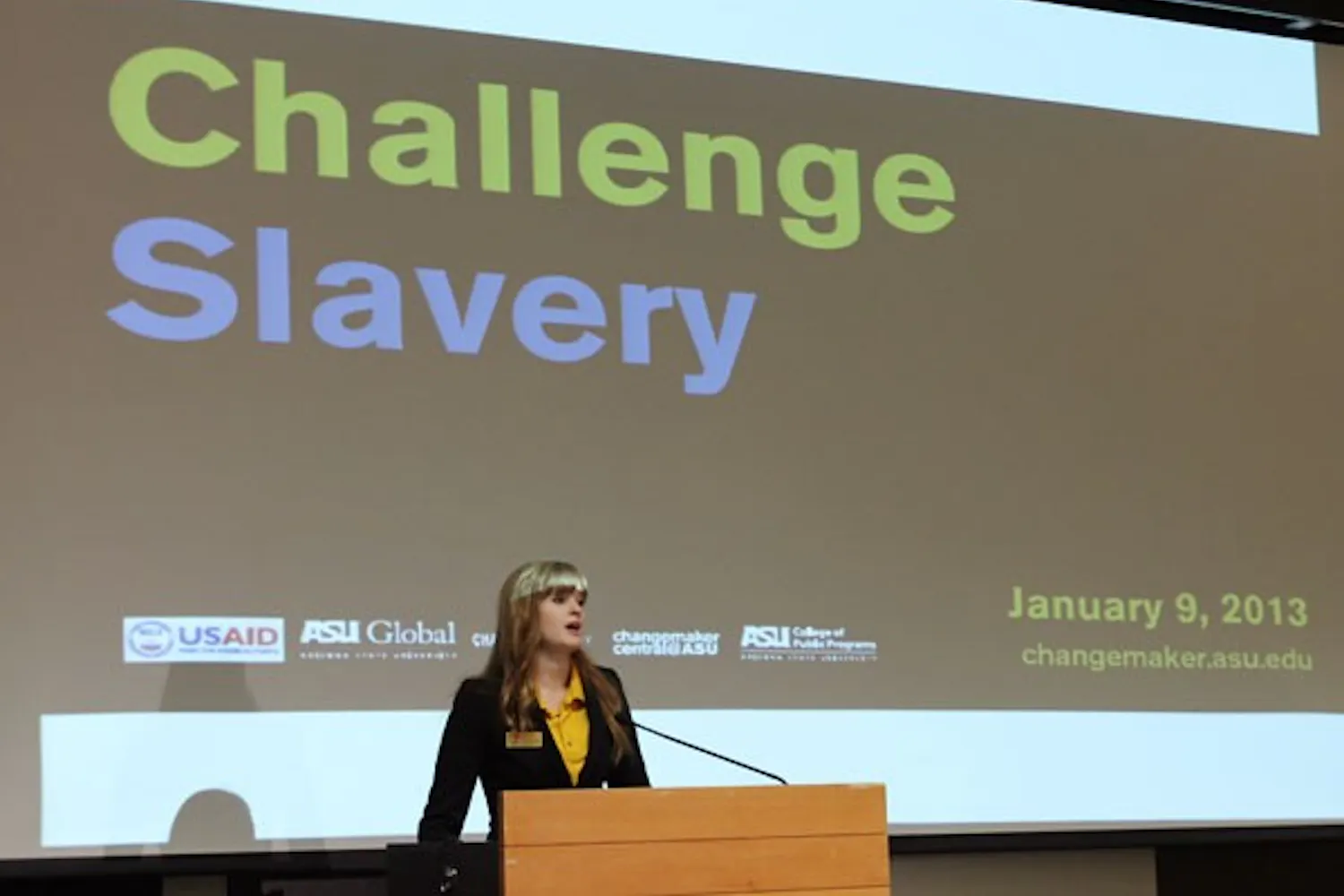 Student Direction of Changemaker Central Kaitlyn Fiztgerald addresses the audience of Challenge Slavery. Challenge Slavery was held in the Memorial Union on Wednesday to inform about the modern slave trade. (Photo by Laura Davis)