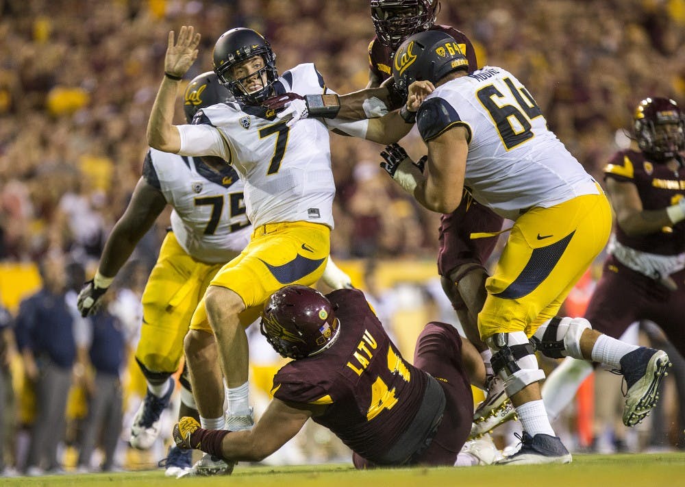 California Golden Bears quarterback Davis Webb (7) is tackled by Arizona State Sun Devils defensive lineman Viliami Latu (41) after throwing the ball during a game against the California Golden Bears in Sun Devil Stadium in Tempe, Arizona, on Saturday, Sept. 24, 2016. 
