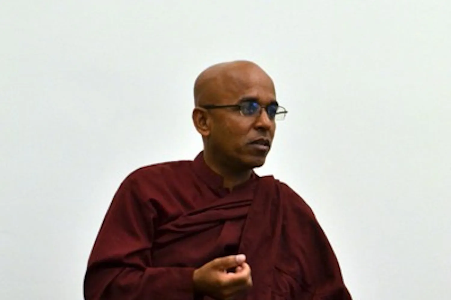 Buddhist Sangha Upasaka Culadasa clarifies the meaning behind meditation to a small group of participants in the Nursing and Health Innovation building on the Downtown campus Thursday afternoon. (Photo by Brittany Lea)