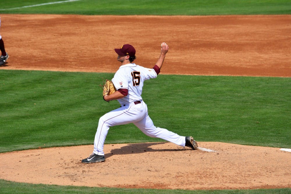 Freshman infielder/outfielder Dalton DiNatale slides safely into first after an attempted pick off move in a home game against California on April 13. (Photo by Mario Mendez)