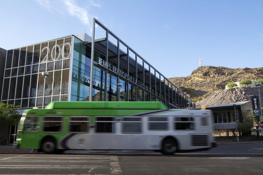 A Tempe metro bus passes by the Tempe Transportation Center on June 3, 2014. 