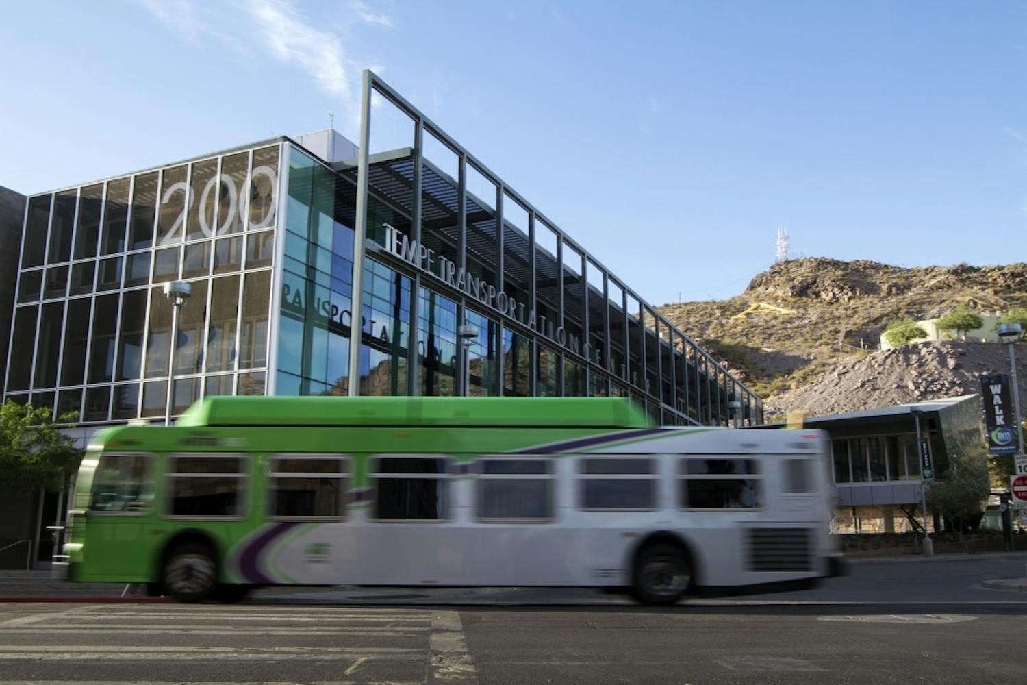 A Tempe metro bus passes by the Tempe Transportation Center on June 3, 2014. 