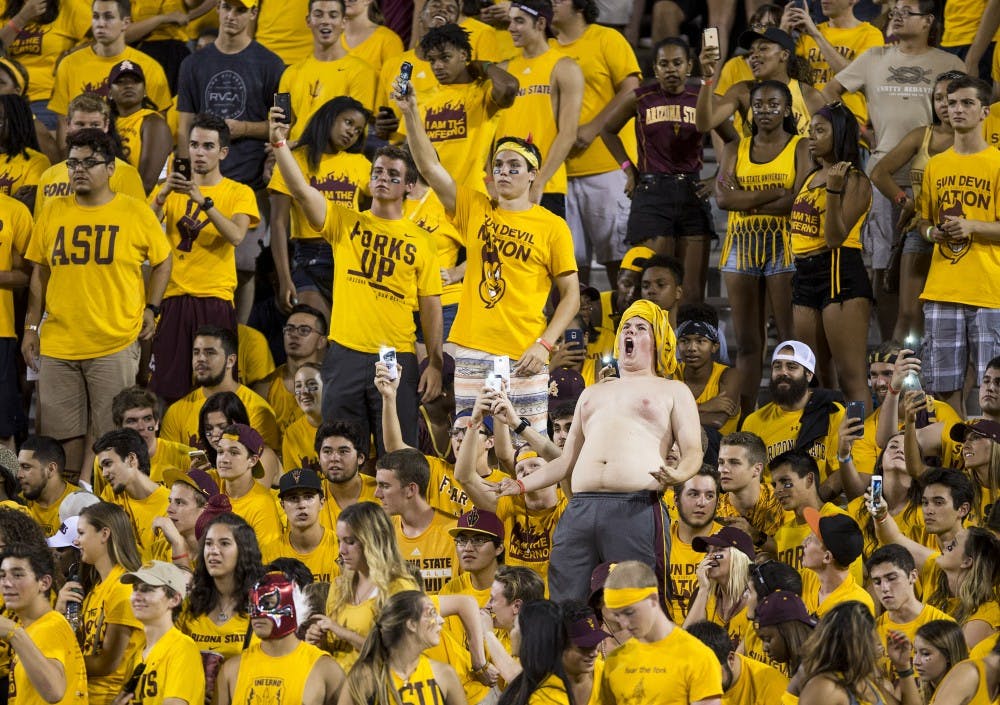 Students in the Inferno section cheer on the Sun Devils during a game against visiting Cal Poly at Sun Devil Stadium in Tempe on Saturday, Sept. 12, 2015. ASU beat Cal Poly 35-21 in their season opener. 