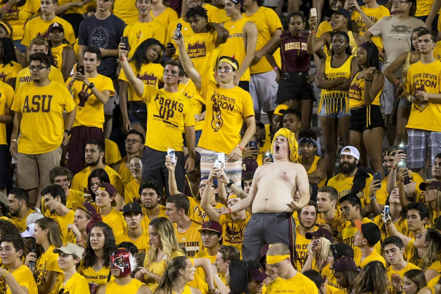 Students in the Inferno section cheer on the Sun Devils during a game against visiting Cal Poly at Sun Devil Stadium in Tempe on Saturday, Sept. 12, 2015. ASU beat Cal Poly 35-21 in their season opener. 