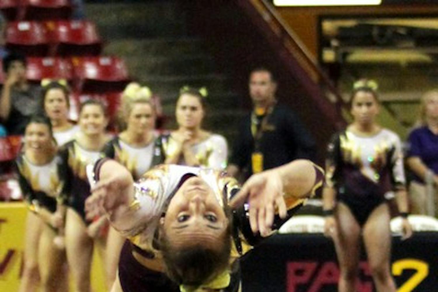Junior Samantha Seaman takes one last look at the vault before going into her flip on March 15 in meet against Bridgeport. The meet against Bridgeport was Senior Night and Seaman’s first meet after her injury. (Photo by Arianna Grainey)
