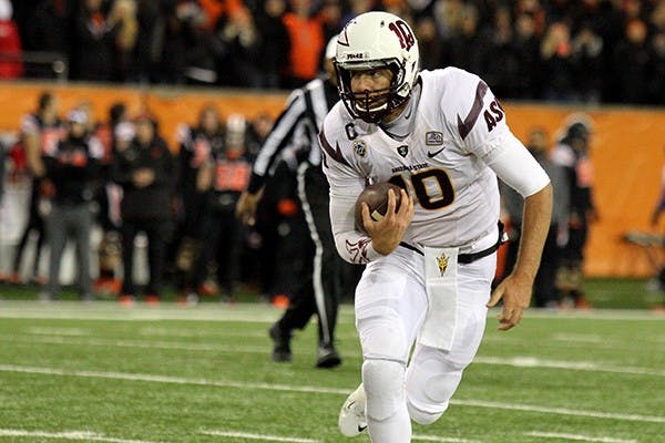 Redshirt senior quarterback Taylor Kelly runs with the ball in a game against Oregon State in Corvallis on Saturday, Nov. 16, 2014. ASU lost against OSU 35-28. (Photo Courtesy of Justin Quinn - Daily Barometer)