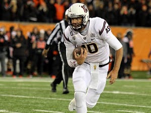 Redshirt senior quarterback Taylor Kelly runs with the ball in a game against Oregon State in Corvallis on Saturday, Nov. 16, 2014. ASU lost against OSU 35-28. (Photo Courtesy of Justin Quinn - Daily Barometer)