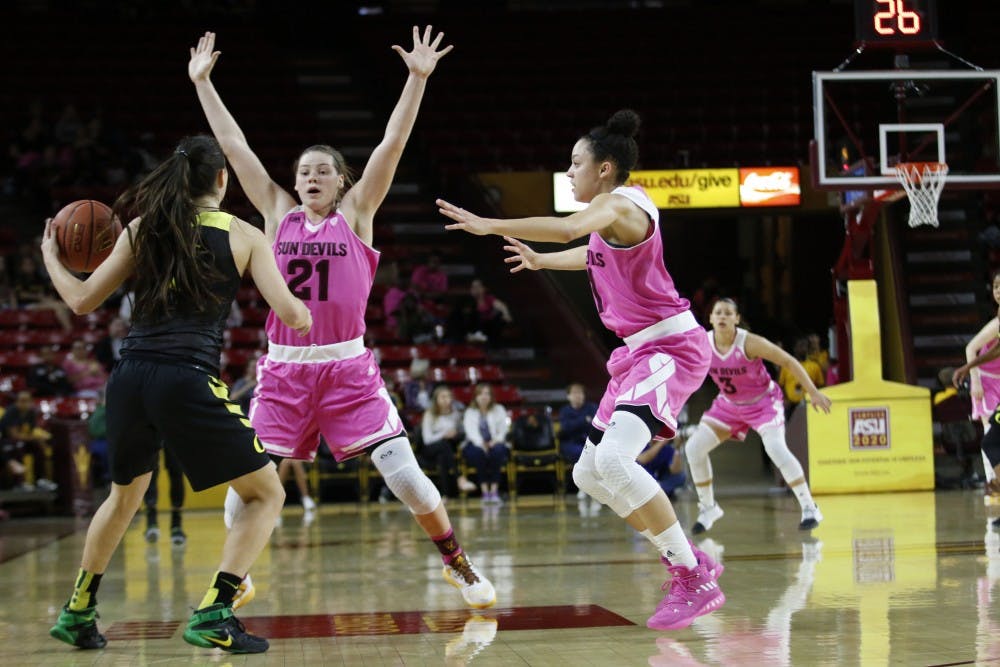 ASU senior Sophie Brunner (21) and freshman Reili Richardson (1) defend in a basketball game against Oregon at the Wells Fargo Arena in Tempe, Ariz. on Sunday Feb. 5, 2017.