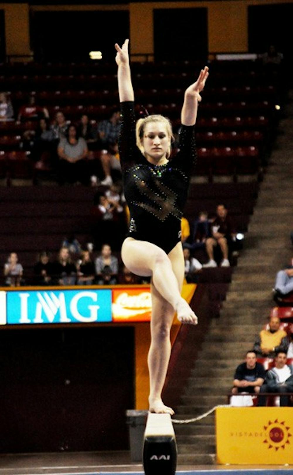 Finding Balance: Sophomore Amelia Rew performs on the beam for ASU during the Sun Devils’ victory over Brown on Friday in Tempe. A few shaky performances on beam were the only blip for the Sun Devils, who coasted to a victory over the Bears. (Photo by Sierra Smith)