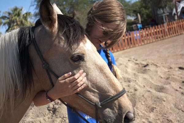  HAVING A MOMENT: Fourteen-year-old volunteer for Robinson Ranch Nicole Bokanoski trains with Destiny on Saturday afternoon. (Photo by Shawn Raymundo)
