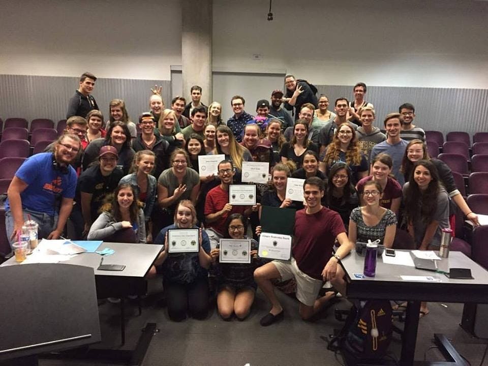 Members of the Kappa Kappa Psi of Beta Omicron pose for a group picture on April 8, 2017.