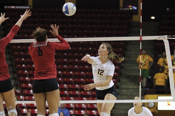 Junior outside hitter Macey Gardner hits the ball past the Stanford front line during the Sun Devils’ 3-1 loss to the Cardinal on Sunday, Oct. 4, 2012. (Photo by Kyle Newman)