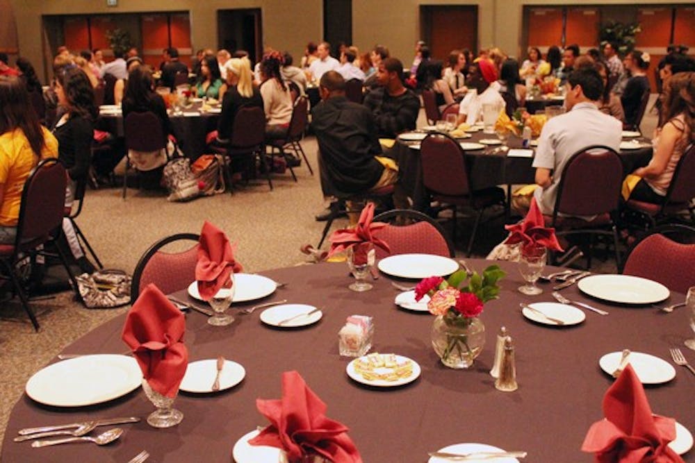 Barrett, The Honors College hosted a free dinner for students on the West campus Wednesday night. While they ate, Carol Bory gave guidance on proper etiquette during business meals. (Photo by Jenn Allen)